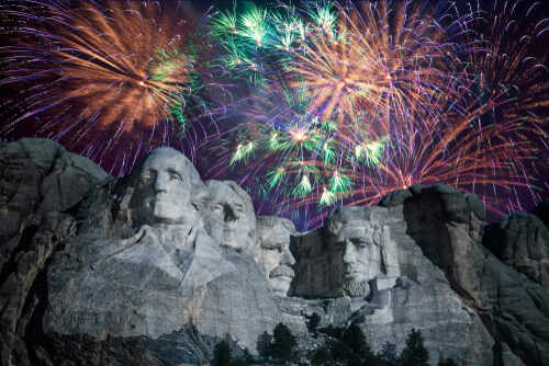 Fireworks exploding over Mount Rushmore at night