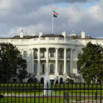 Massive Ballroom Project Sparks OUTRAGE The White House with an American flag flying above it