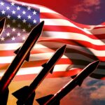 Silhouette of missiles in front of an American flag
