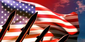 Silhouette of missiles in front of an American flag