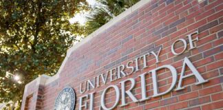 Sign for the University of Florida on a brick wall