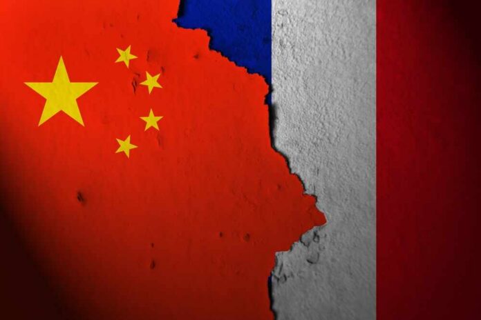 shutterstock_2384696737.jpg A textured wall displaying the flags of China and France