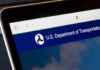 Close-up of a digital screen displaying the U.S. Department of Transportation website