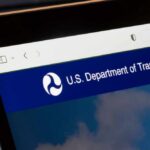 Close-up of a digital screen displaying the U.S. Department of Transportation website