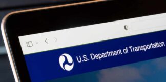 Close-up of a digital screen displaying the U.S. Department of Transportation website