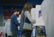 A person casting their vote at a polling station