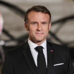 Is France Secretly Aligning With U.S. Strategy? Emmanuel Macron in formal attire at a state event