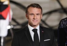 Emmanuel Macron in formal attire at a state event