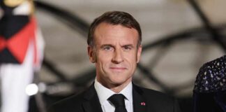 Emmanuel Macron in formal attire at a state event