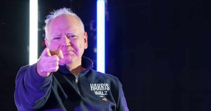 A person pointing confidently at the camera with a serious expression