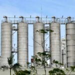 Trump’s Unexpected “Humanitarian” Exception on Cuba Oil Metal storage silos at an industrial facility against a blue sky
