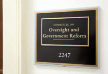 Sign for the Committee on Oversight and Government Reform in an office building
