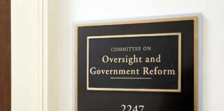 Sign for the Committee on Oversight and Government Reform in an office building