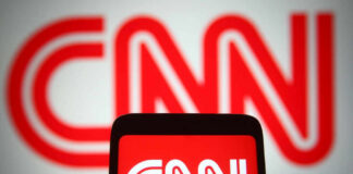 CNN logo displayed on phone and screen.