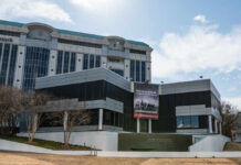 Modern building with a large banner displaying a historical quote
