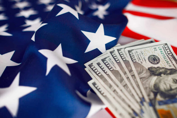 American flag with hundred dollar bills