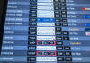 Flight schedule display showing various departure times and statuses