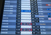 Flight schedule display showing various departure times and statuses