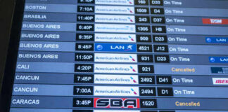 Flight schedule display showing various departure times and statuses