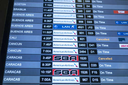 Flight schedule display showing various departure times and statuses