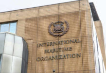 Facade of the International Maritime Organization building with a prominent sign