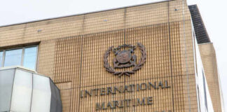 Facade of the International Maritime Organization building with a prominent sign