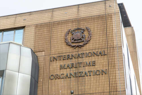 Facade of the International Maritime Organization building with a prominent sign