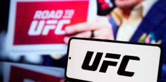 UFC logo displayed prominently with a blurred background of a promotional sign