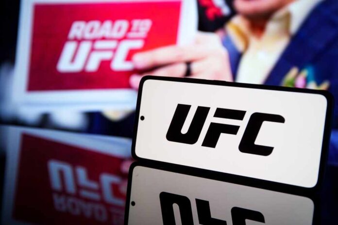 UFC logo displayed prominently with a blurred background of a promotional sign