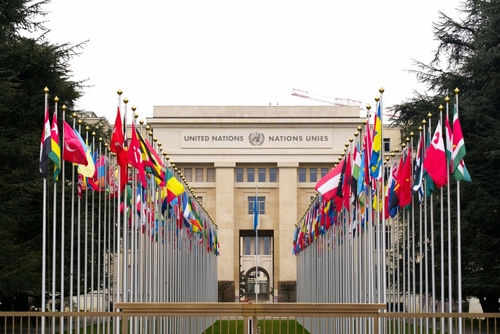 United Nations building with international flags displayed outside