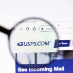 Magnifying glass over USPS.com website page.