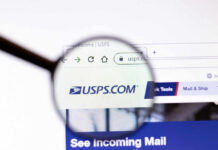 Magnifying glass over USPS.com website page.