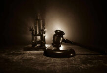 Shocking Turn: 60 Lawmakers Challenge Death Row Conviction Gavel and electric chair in dimly lit room
