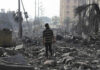 New Allegations Emerge From Gaza Detentions Person walking through rubblestrewn street in daylight