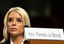 Cancer Fight EXPOSED: Pam Bondi’s Hidden Struggle Woman sitting behind nameplate at conference or meeting