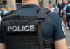 Police officer in uniform with badge on the arm