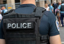 Police officer in uniform with badge on the arm