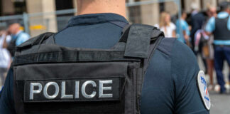Police officer in uniform with badge on the arm