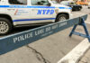 Child Choked in Brooklyn Heist—Suspect Still Loose! NYPD police barricade on city street with vehicles