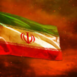 Trump’s Risky Iran Play: What’s the Endgame? Iranian flag waving against a dramatic orange sky