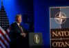 U.S. president delivering a speech at a NATO summit