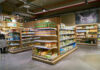 SURGING Food Prices—Families Feel the Squeeze Supermarket aisle with various organic food products displayed