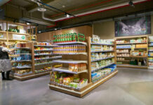 Supermarket aisle with various organic food products displayed