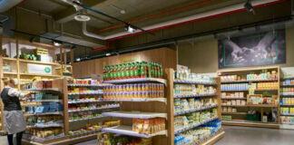 Supermarket aisle with various organic food products displayed