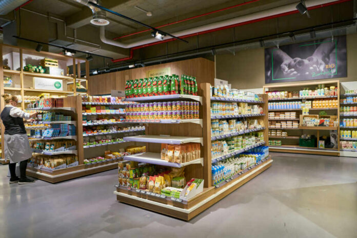 Supermarket aisle with various organic food products displayed