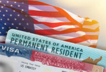 U.S. flag with visa and permanent resident card in foreground