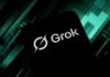 AI-First War Plan Sparks Bipartisan Alarm Smartphone screen displaying the Grok logo on a dark tech-themed background