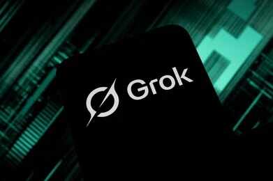 2696131879 Smartphone screen displaying the Grok logo on a dark tech-themed background