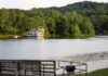 Missing Teen, Troubling Questions Remain Forested peninsula on a calm lake with autumn foliage and distant hills