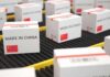 Shipping boxes labeled made in China on a conveyor belt